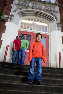 Hispanic Family in Front of School