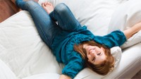 Woman on Couch Looking Up